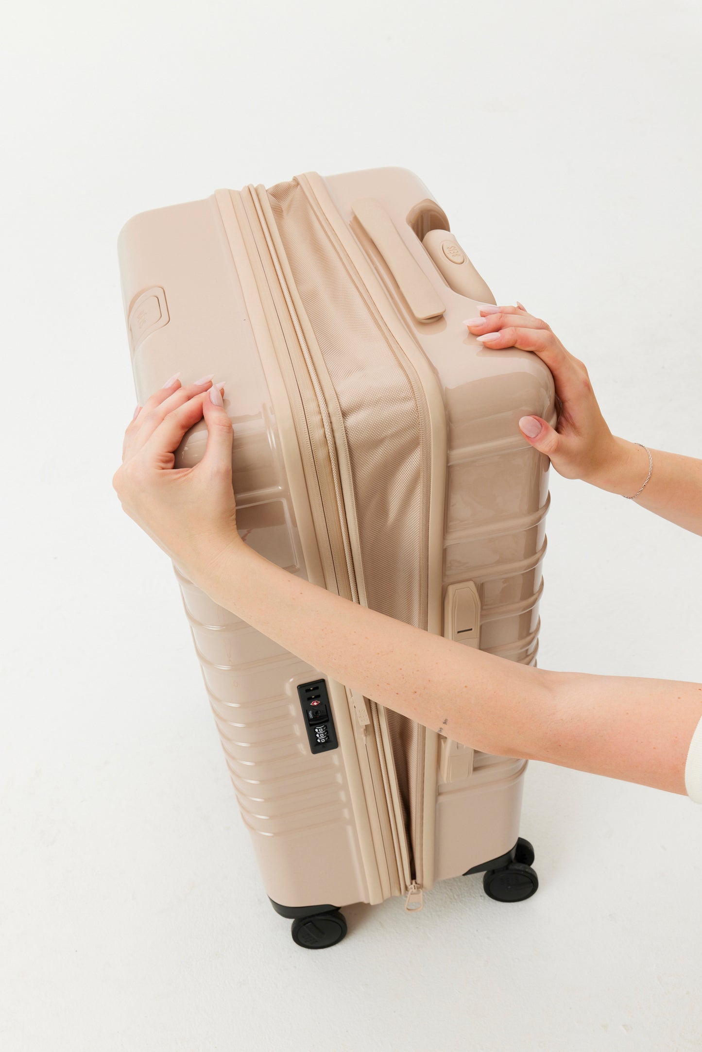 The Medium Check-In Roller in Glossy Beige