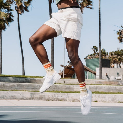 Legs of a black athlete jumping up