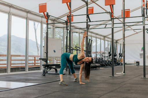 Woman doing workout in an empty gym