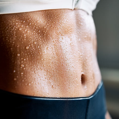 Sweaty torso of a girl in the gym