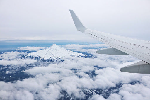 Airplane in the sky above the clouds