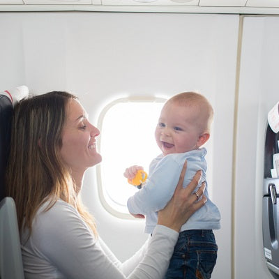 mum and boy on board of aircraft