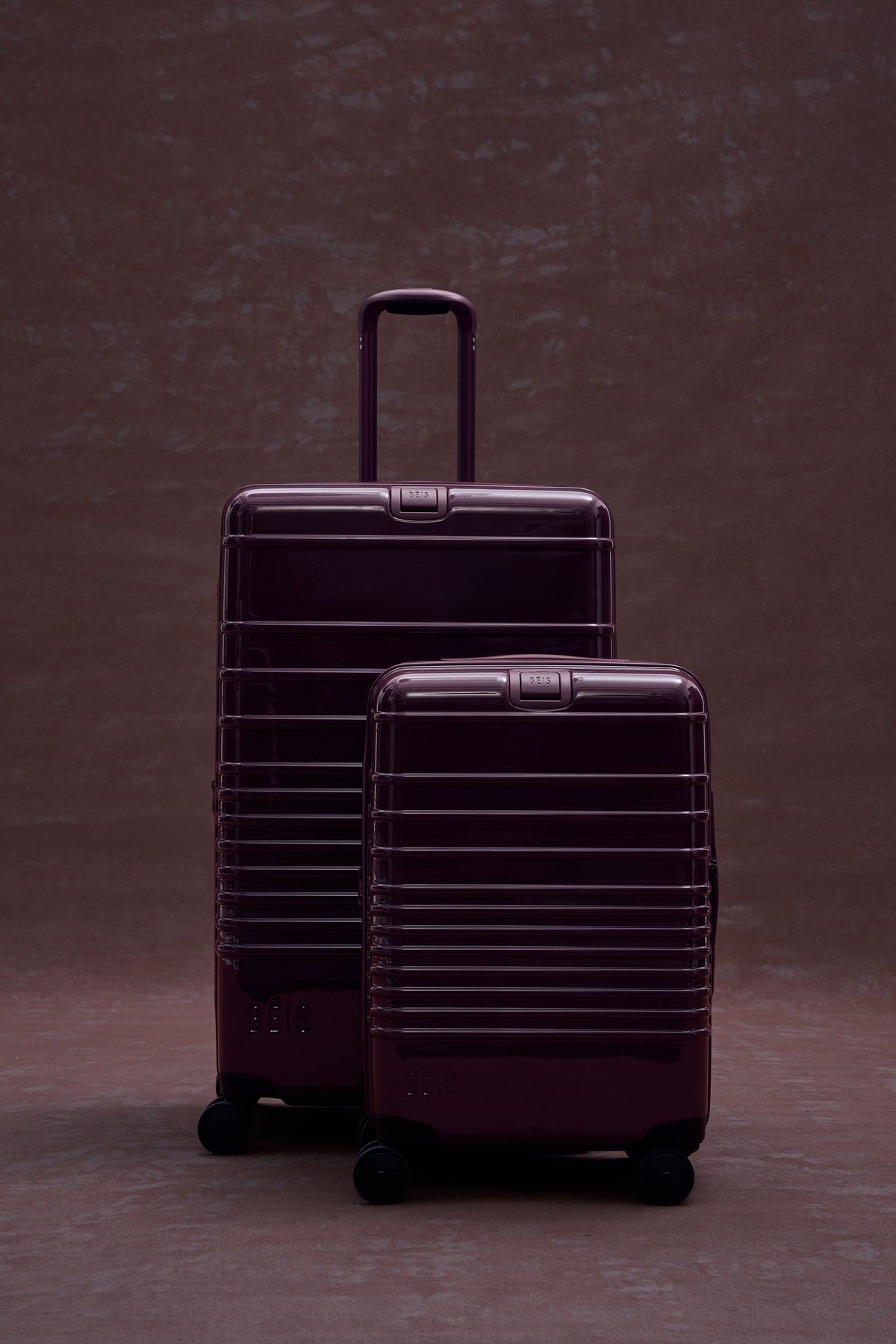 The Large Check-In Roller in Glossy Plum