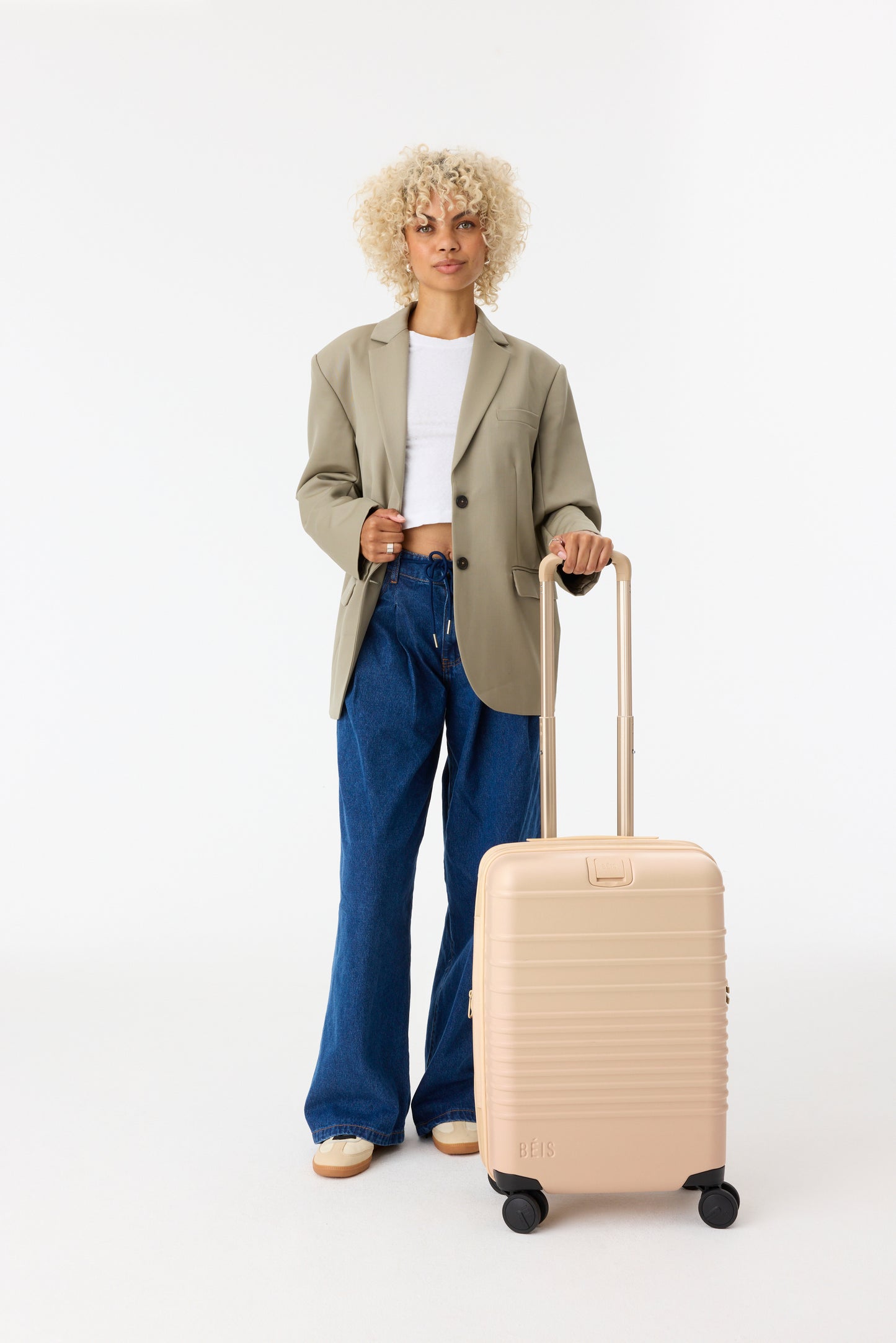 The Carry-On Roller in Beige - how to plan a winter family vacation on a budget