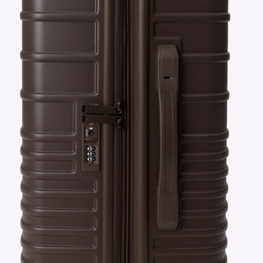 Brown suitcase with a handle on a white background