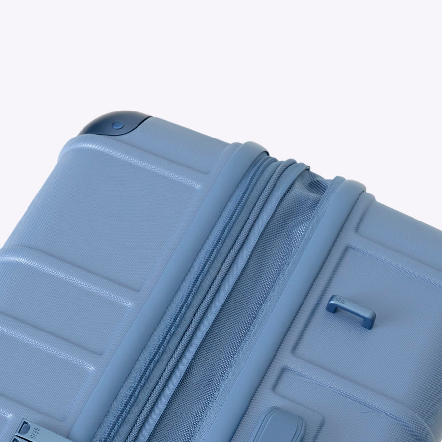 Blue suitcase on a white background