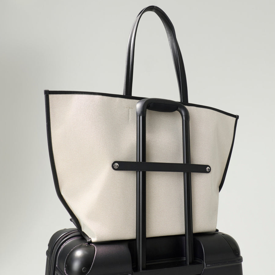 Black and white handbag on a gray background