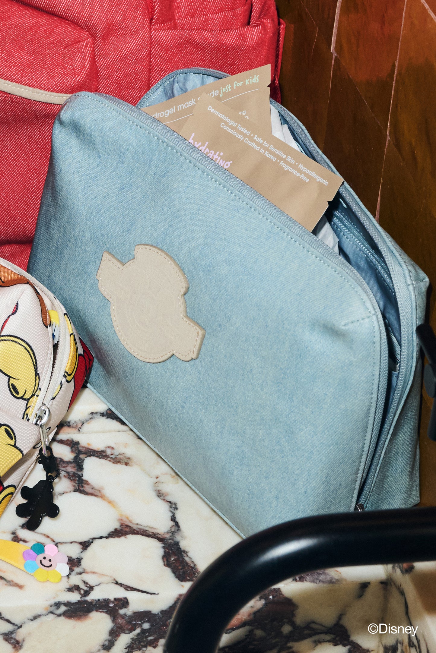 The Disney Small Cosmetic Pouch in Blue Jeans