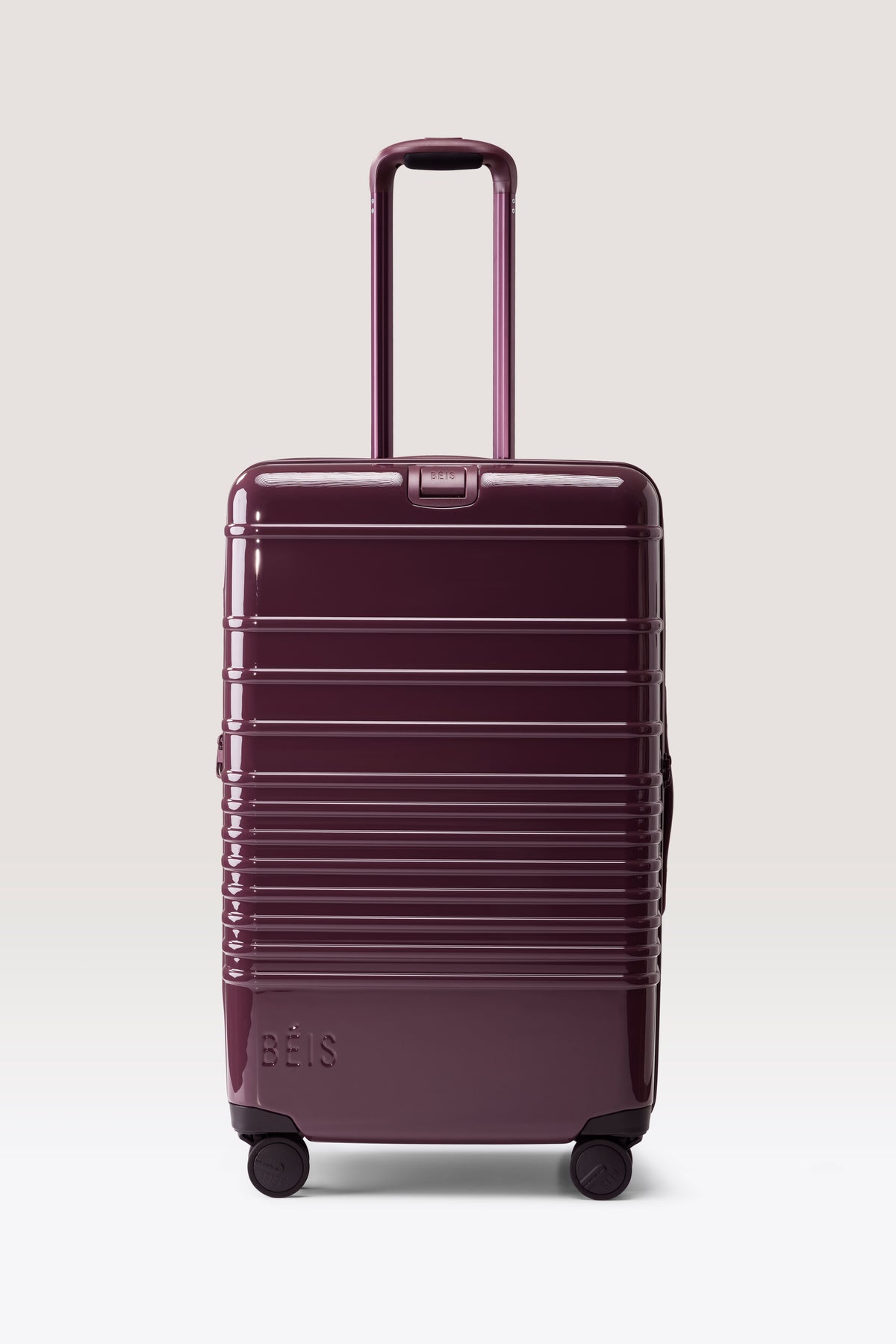 The Medium Check-In Roller in Glossy Plum