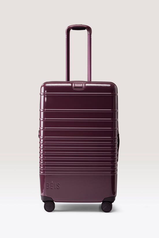 The Medium Check-In Roller in Glossy Plum