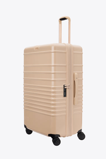The Large Check-In Roller in Glossy Beige