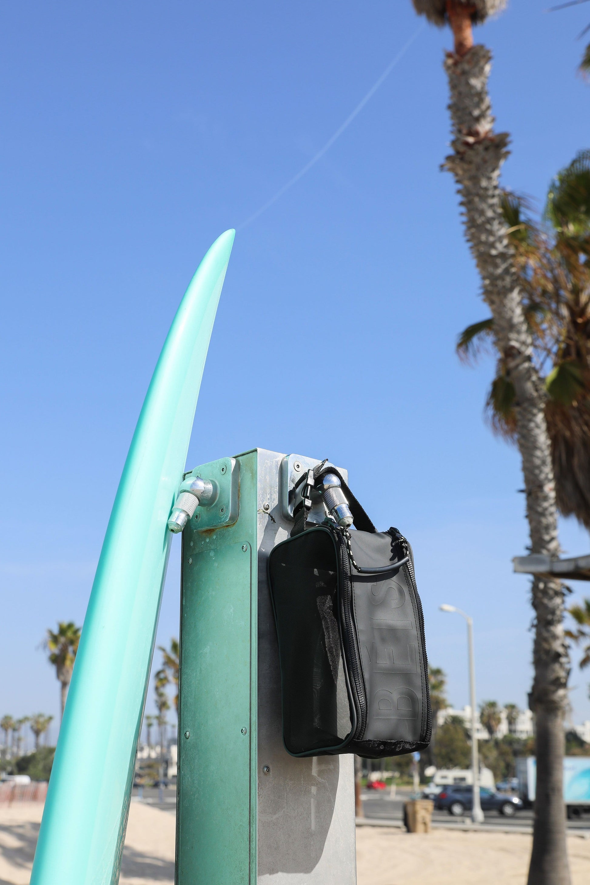 Hanging Shower Caddy Black Hanging on Shower at Beach with Surfboard