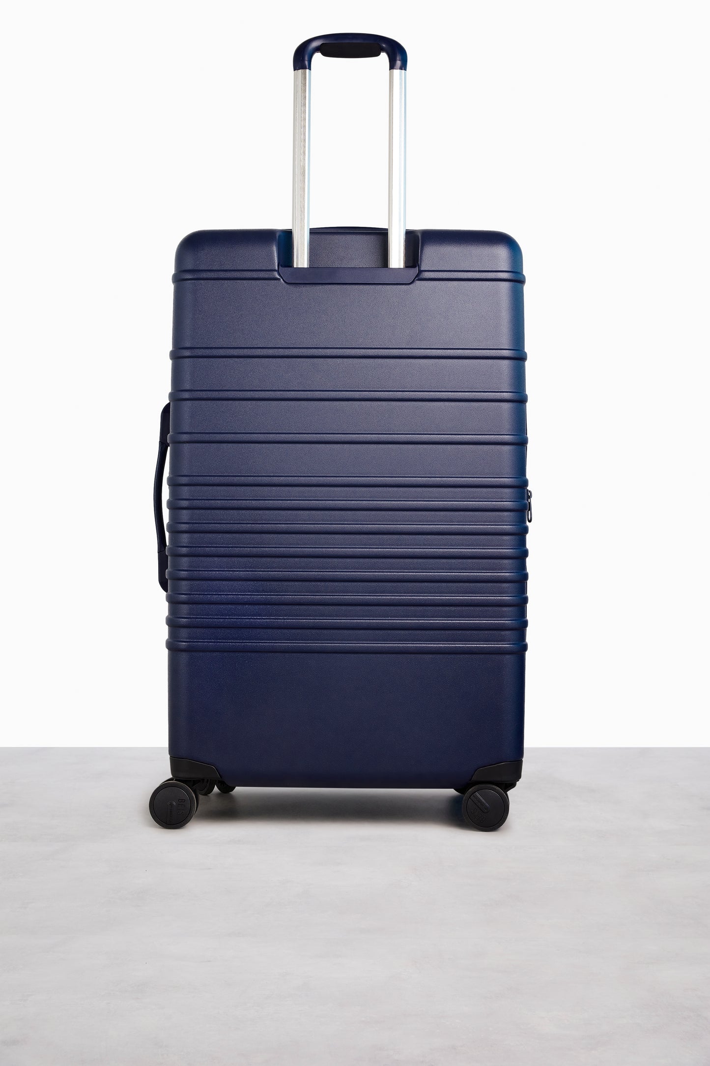 The Large Check-In Roller in Navy