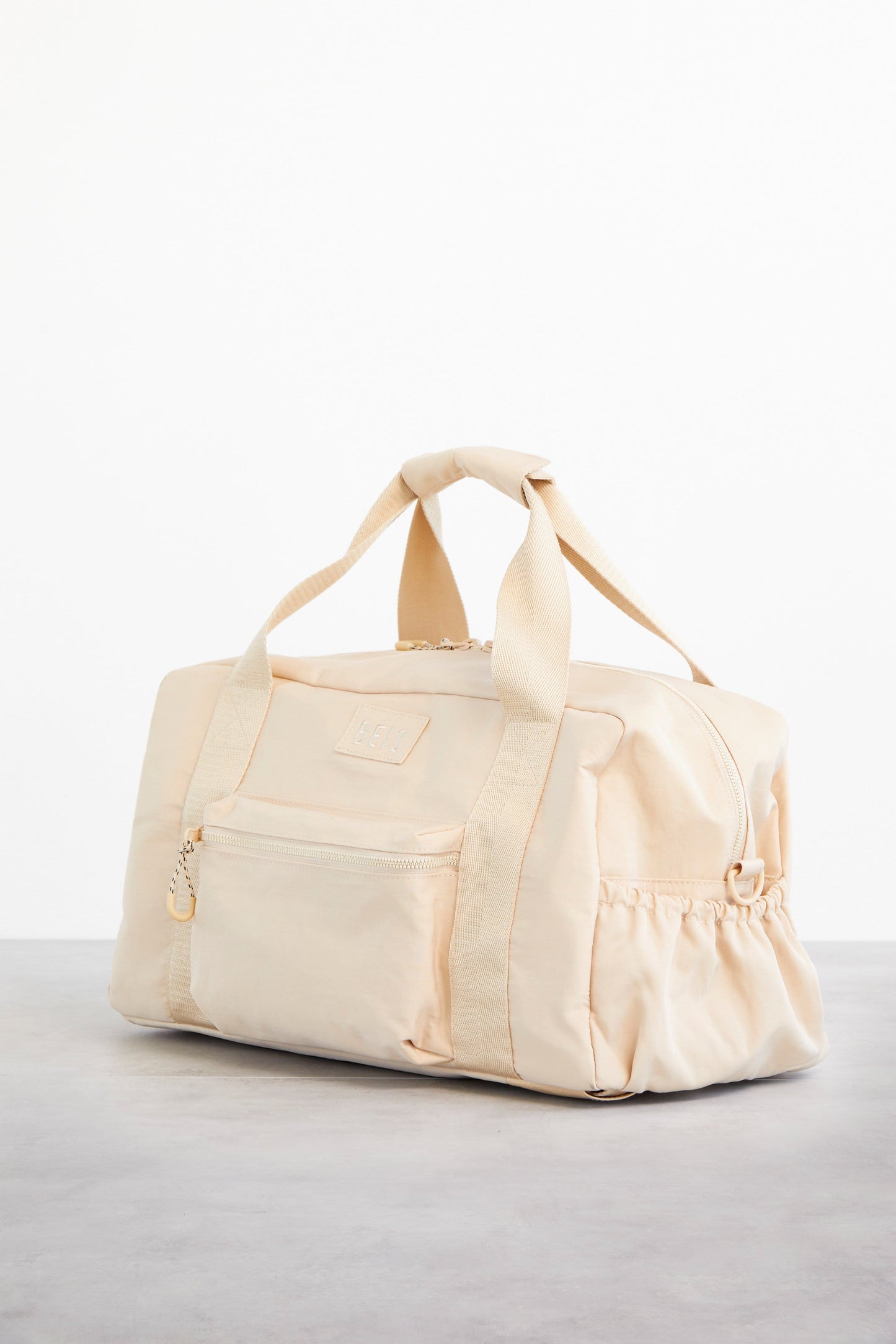 Sport Duffle Beige Front and Side Angle