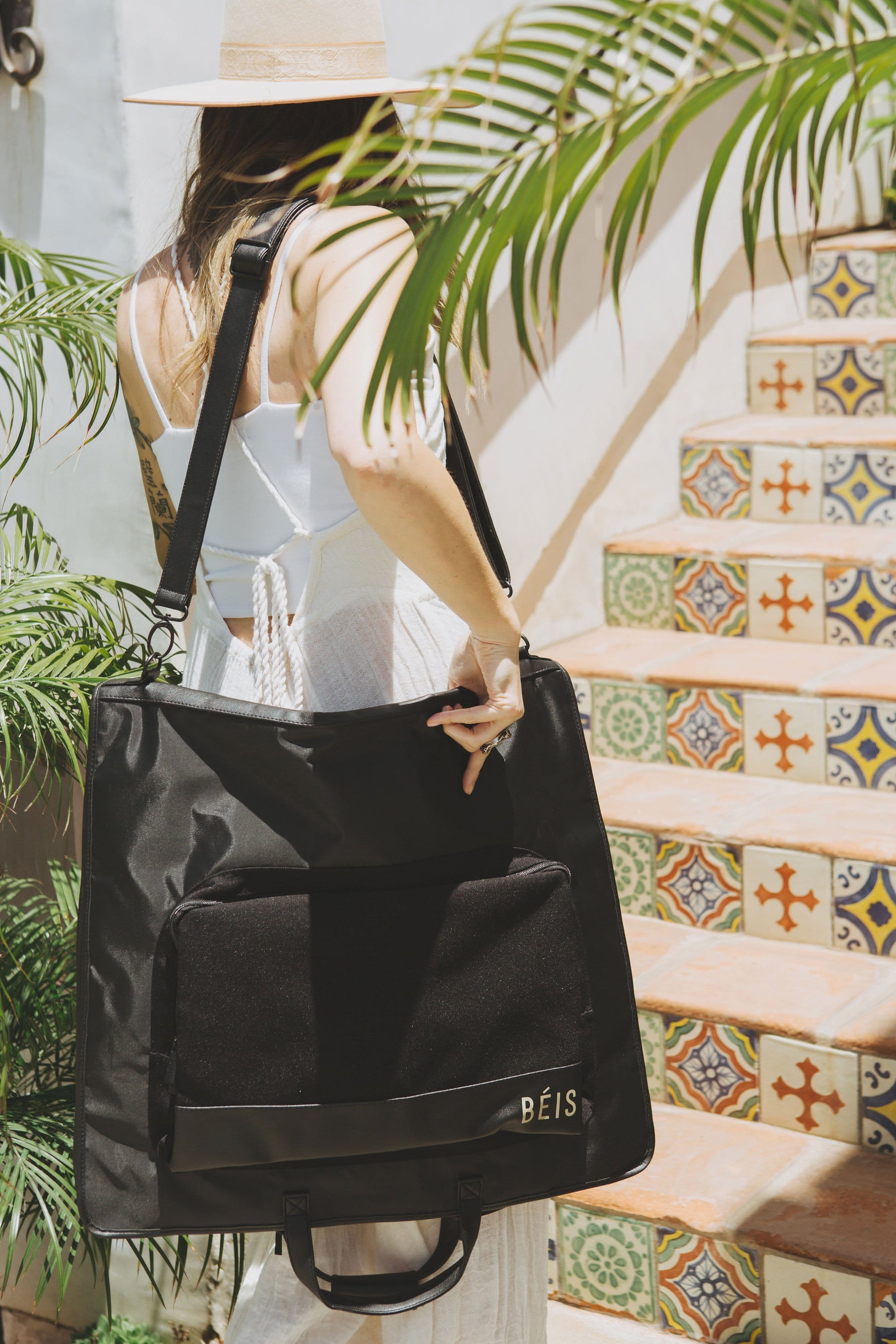 Travel Garment Bag Black Folded with Shoulder Strap on Model